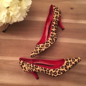 Leopard print pointy heels with red bottoms